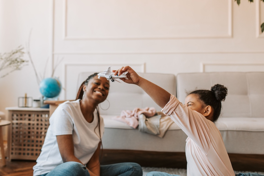 Therapist sitting with a child during a calm ABA therapy session